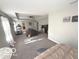 Spacious carpeted main bedroom featuring a tray ceiling and neutral walls at 520 Ferndale Ln, Danville, IN 46122