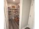 This large pantry is stocked with shelving to organize lots of food at 520 Ferndale Ln, Danville, IN 46122