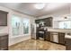 Well-lit kitchen features stainless steel appliances, granite countertops and dark cabinetry at 525 Orange St, Indianapolis, IN 46203