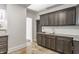 Spacious kitchen features dark cabinets, granite countertops, and a view to another room at 525 Orange St, Indianapolis, IN 46203