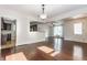 Open-concept living space with hardwood floors and view to kitchen and sitting area at 525 Orange St, Indianapolis, IN 46203