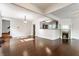 Spacious living area with hardwood floors, featuring open access to the kitchen and a decorative fireplace at 525 Orange St, Indianapolis, IN 46203