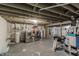 Basement with washer/dryer hookups and workout equipment; ready for your creativity at 535 Radburn Dr, Indianapolis, IN 46214