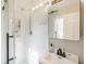 Bathroom featuring a modern shower and sink vanity with great natural light at 535 Radburn Dr, Indianapolis, IN 46214