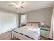 Bedroom showcasing a closet, window, ceiling fan, and a bed, offering comfort at 535 Radburn Dr, Indianapolis, IN 46214