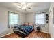 Charming bedroom featuring natural light, ceiling fan, and stylish accents at 535 Radburn Dr, Indianapolis, IN 46214