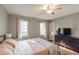 Bright bedroom with a ceiling fan, lots of natural light and attractive vinyl floors at 535 Radburn Dr, Indianapolis, IN 46214