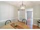 Comfortable dining room with a modern light fixture and access to a connecting room at 535 Radburn Dr, Indianapolis, IN 46214