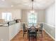 Inviting dining area with a round table, black chairs and stylish pendant lighting at 535 Radburn Dr, Indianapolis, IN 46214