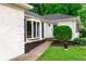 Charming exterior view showcasing a light blue door with a walkway and green shrubbery at 535 Radburn Dr, Indianapolis, IN 46214