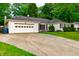 Inviting single-story home features a driveway and an attached two-car garage at 535 Radburn Dr, Indianapolis, IN 46214