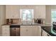 Well-equipped kitchen showcasing stainless steel appliances, granite counters, and white cabinets at 535 Radburn Dr, Indianapolis, IN 46214