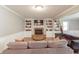 Cozy living room with a brick fireplace, built-in bookshelves, and comfortable seating for relaxing and entertaining at 535 Radburn Dr, Indianapolis, IN 46214