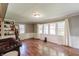 Bright sun room with hardwood floors, large windows, and ample natural light, perfect for relaxing or entertaining at 535 Radburn Dr, Indianapolis, IN 46214