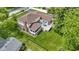 Aerial view of the house shows the screened in porch, back deck, and large manicured lawn at 59 Sycamore Dr, Carmel, IN 46033