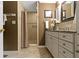 Elegant bathroom featuring a walk-in shower with neutral tile, and vanity with under-cabinet storage at 59 Sycamore Dr, Carmel, IN 46033