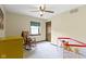 This bright bedroom has a wooden rocking chair and a small crib with toys at 59 Sycamore Dr, Carmel, IN 46033