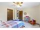 This bedroom features two closets with wood-framed doors and a small bookcase at 59 Sycamore Dr, Carmel, IN 46033