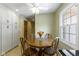 Cozy breakfast nook with natural light, tile flooring, and traditional wood table at 59 Sycamore Dr, Carmel, IN 46033