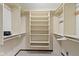 This closet includes shelving with hanging rods to maximize space and provide organization at 59 Sycamore Dr, Carmel, IN 46033