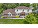 Beautiful two-story home featuring brick and siding, a well-kept lawn, and a tidy landscape at 59 Sycamore Dr, Carmel, IN 46033