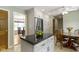 Bright kitchen featuring white cabinetry, black granite countertops, stainless steel appliances, and tile floors at 59 Sycamore Dr, Carmel, IN 46033