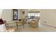 Spacious living room with hardwood floors, a china cabinet, and two sitting areas at 59 Sycamore Dr, Carmel, IN 46033