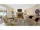 Comfortable living room with fireplace, built-in shelving, and neutral carpet at 59 Sycamore Dr, Carmel, IN 46033