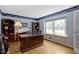 Traditional office space with hardwood floors, a large wooden desk, and ample natural light at 59 Sycamore Dr, Carmel, IN 46033