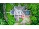 Aerial view of the house showcasing the roof and surrounding greenery at 6125 N Olney St, Indianapolis, IN 46220