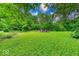 Lush backyard showcasing a tranquil fire pit area and beautifully maintained greenery at 6125 N Olney St, Indianapolis, IN 46220