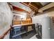 Unfinished basement space with sink, storage and utility components at 6125 N Olney St, Indianapolis, IN 46220
