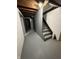 Basement with stairs and storage, offering potential for customization at 6125 N Olney St, Indianapolis, IN 46220