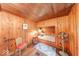 Charming bedroom space features wood paneling, a comfortable alcove bed, and decorative accents at 6125 N Olney St, Indianapolis, IN 46220