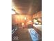 Cozy bedroom with wood-paneled walls, a daybed, and a decorative area rug at 6125 N Olney St, Indianapolis, IN 46220