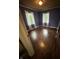 Bedroom featuring hard wood floors, two windows, and neutral walls at 6125 N Olney St, Indianapolis, IN 46220