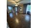Bedroom with hardwood floors, multiple windows, and neutral wall paint at 6125 N Olney St, Indianapolis, IN 46220