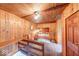 Unique bedroom with wood paneling and built-in alcove bed, creating a cozy and inviting space at 6125 N Olney St, Indianapolis, IN 46220