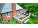 Brick home with lush greenery and potential outdoor upper story at 6125 N Olney St, Indianapolis, IN 46220