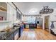 Bright kitchen featuring updated appliances, contrasting cabinetry, and a decorative light fixture at 6125 N Olney St, Indianapolis, IN 46220