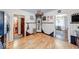 A corner of the kitchen featuring checkered tile work, unique fixtures, and wood flooring at 6125 N Olney St, Indianapolis, IN 46220