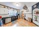 Spacious kitchen with stainless steel appliances, custom cabinets, and unique decorative elements at 6125 N Olney St, Indianapolis, IN 46220