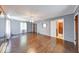 Cozy living room featuring hardwood floors, natural light, and neutral paint at 6125 N Olney St, Indianapolis, IN 46220