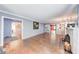 Bright living room with hardwood floors, fireplace, and arched doorway leading to other rooms. Lots of natural light at 6125 N Olney St, Indianapolis, IN 46220