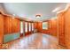Bright room with wood paneling, stylish flooring, and plenty of natural light at 6125 N Olney St, Indianapolis, IN 46220
