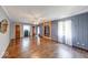 Inviting living room showcases beautiful hardwood floors, crown molding, and a decorative mirror at 6125 N Olney St, Indianapolis, IN 46220