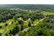 Picturesque aerial view of home near golf course, lake, and lush greenery, in a desirable location at 6164 Afton Crest, Indianapolis, IN 46220