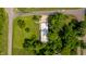 Aerial shot of a modern home with a multi-car garage, surrounded by a well-manicured lawn and mature trees at 6164 Afton Crest, Indianapolis, IN 46220