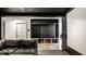 Basement living space with built-in storage, tiled floors, and large sectional sofa at 6164 Afton Crest, Indianapolis, IN 46220
