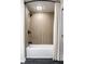 Modern bathroom with tile surround tub, rainfall shower head and tiled walls at 6164 Afton Crest, Indianapolis, IN 46220
